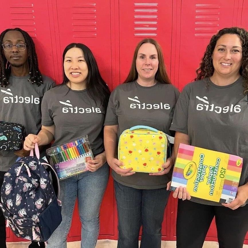 group photo with school supplies donation